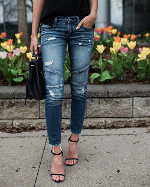 High waisted jeans with tassel belt